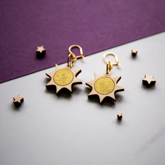 Wooden sun earrings hand painted with gold circle centres.